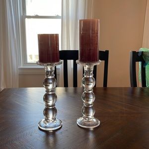 Two glass candle stick holders
